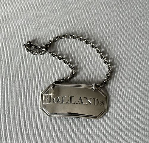 An unsual 18th Century silver Hollands decanter label