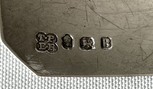 An 18th-century octagonal silver decanter label engraved with HOLLANDS suspended by a silver chain. View III