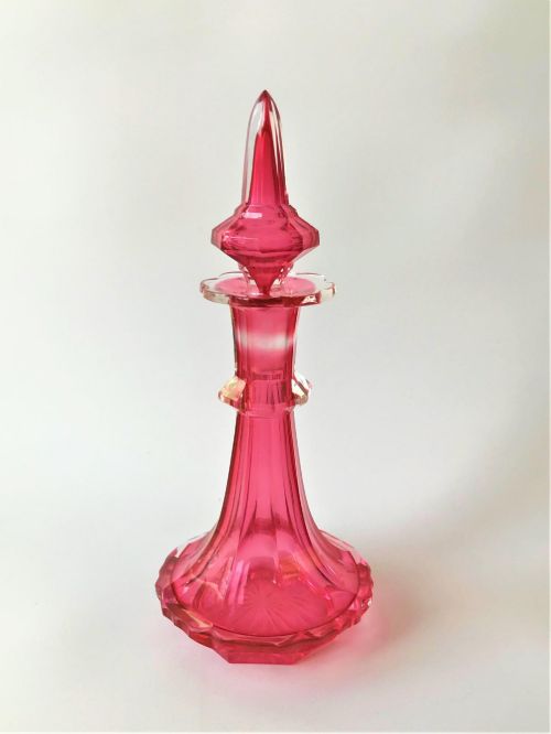 A Stunning Victorian Gothic Cranberry Cut Glass Cologne Bottle