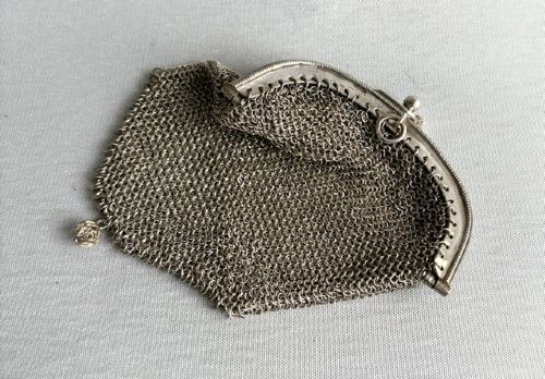fig 1. An antique French silver chain mail coin purse featuring a beaded kiss-lock clasp frame and suspension ring.