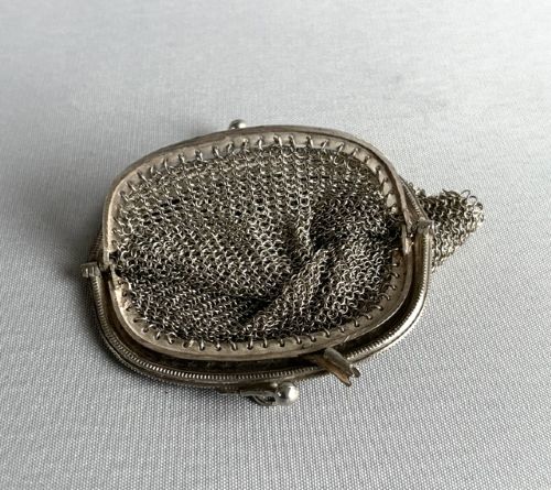 An antique French silver chain mail coin purse featuring a beaded kiss-lock clasp frame and suspension ring. View IV