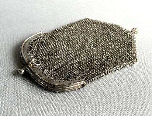 An antique French silver chain mail coin purse featuring a beaded kiss-lock clasp frame and suspension ring. View V