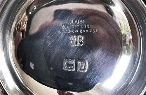 A Victorian silver-mounted cut glass claret jug featuring a globular body with starburst facets, a hinged lid, and a smooth silver handle. View IV