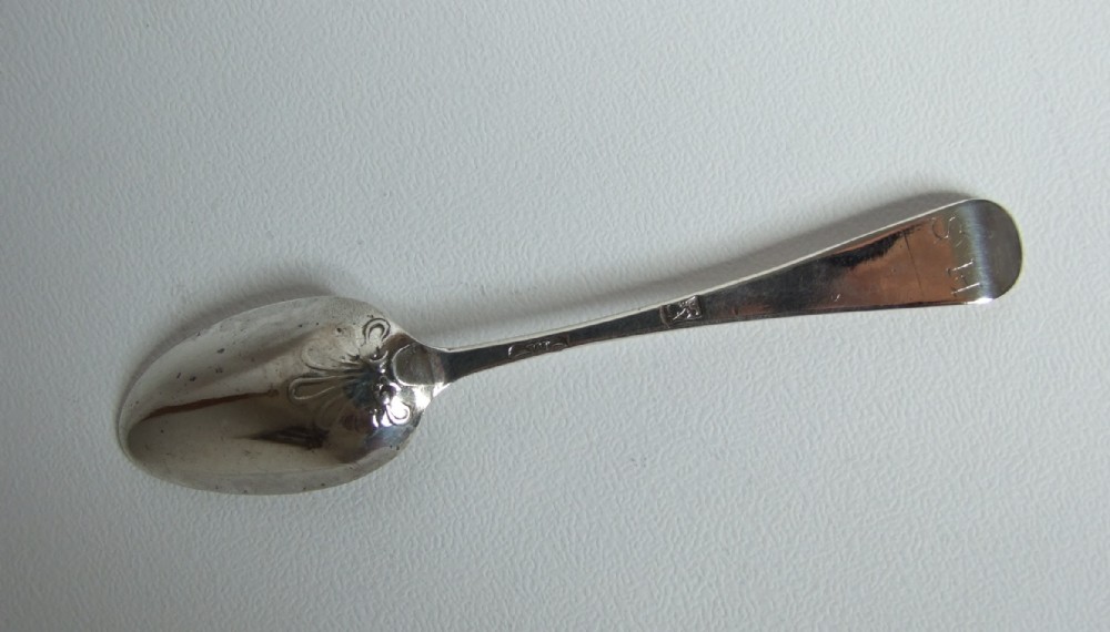 A George II silver fancy-back teaspoon.