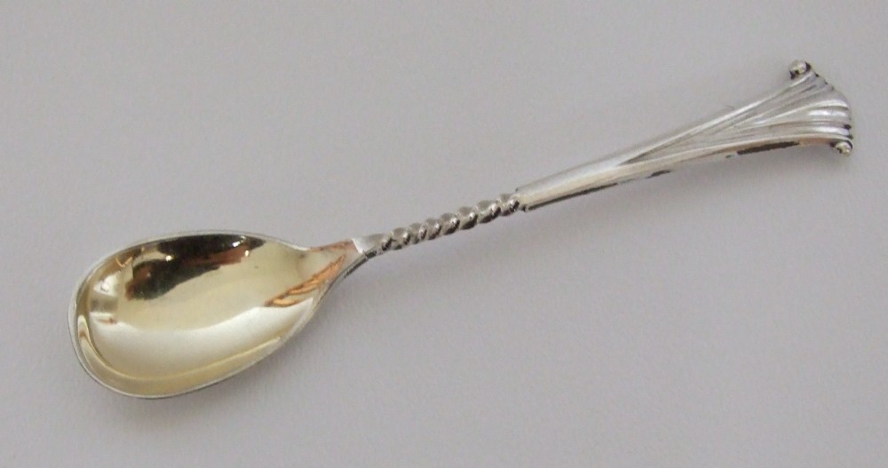 A large silver Onslow pattern condiment spoon.