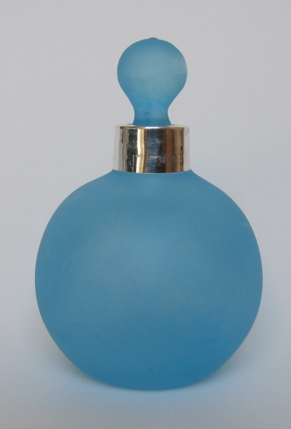 Unusual silver mounted blue scent bottle.