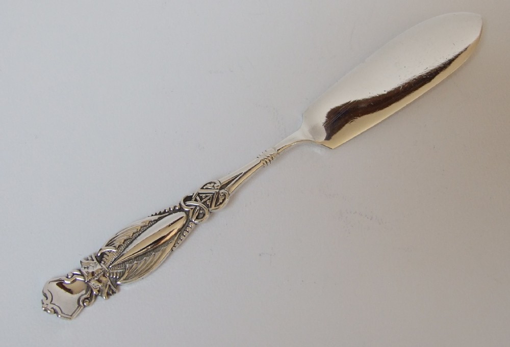 An unusual Victorian Gothic silver butter knife.