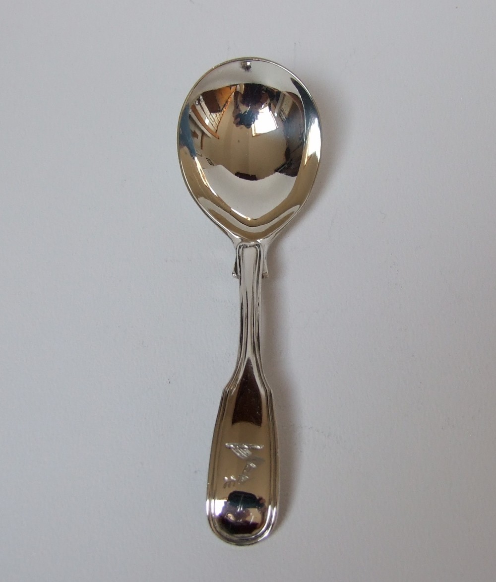 A good Fiddle & Thread pattern silver caddy spoon.