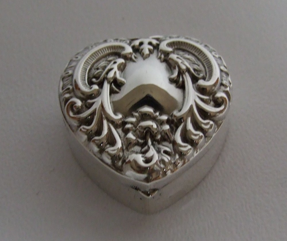 A delightful Edwardian heart shaped silver pillbox.