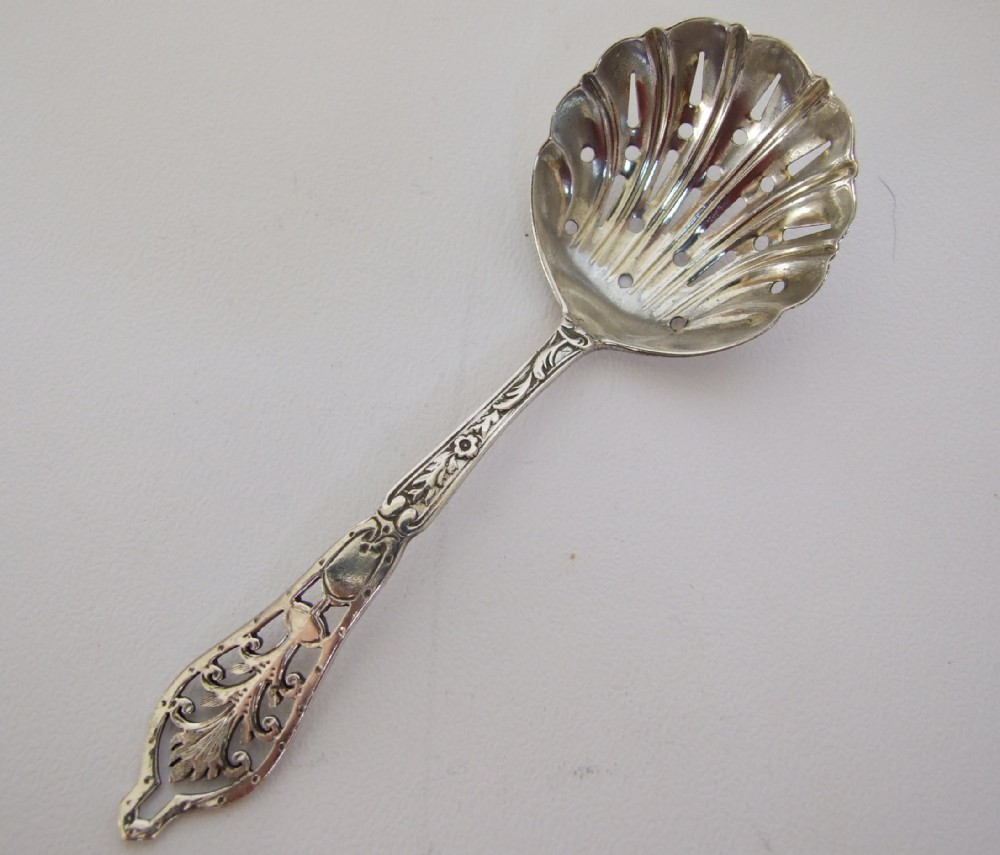 A charming Edwardian pierced silver sifter spoon.