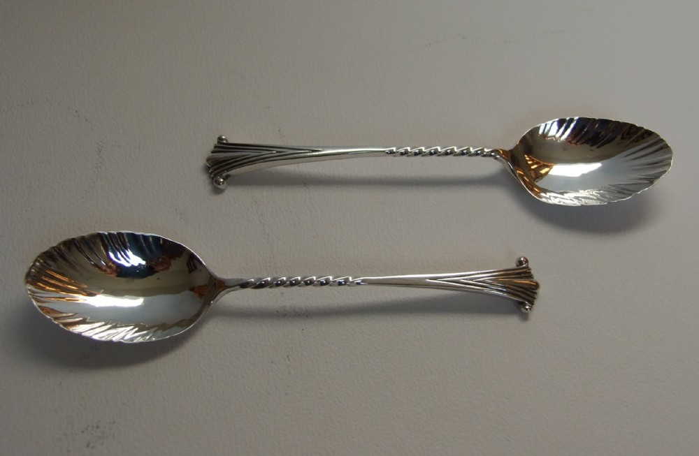 An unusual pair of Victorian silver Onslow pattern teaspoons.