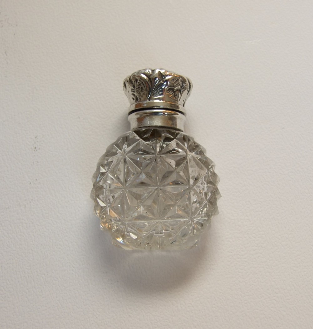 A gorgeous Victorian silver mounted perfume bottle.