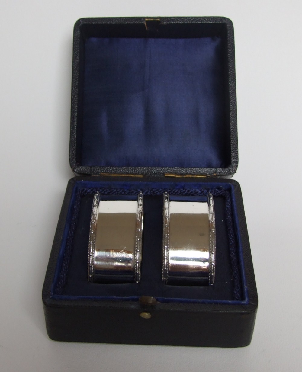 A good quality pair of hallmarked boxed silver napkin rings.