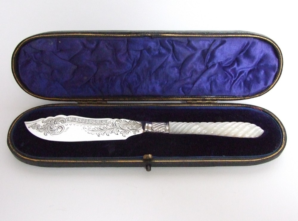 A gorgeous Edwardian silver and mother-of-pearl boxed butter knife.