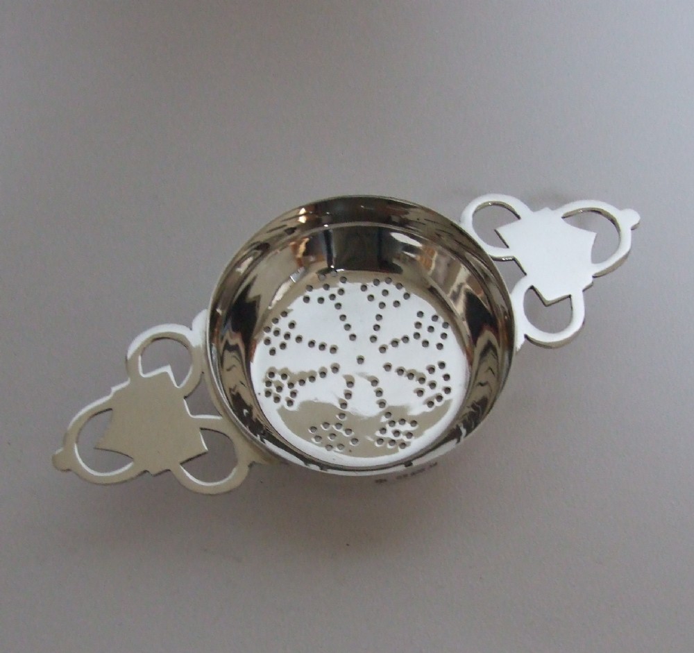 A superb hallmarked silver tea strainer.