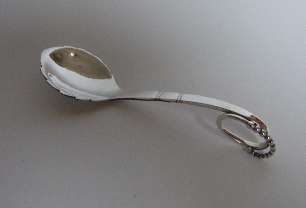 A rare Georg Jensen silver preserve spoon.