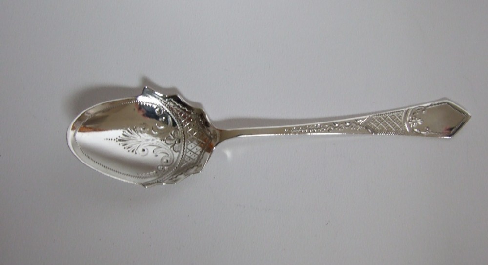 An attractive Edwardian silver preserve spoon.