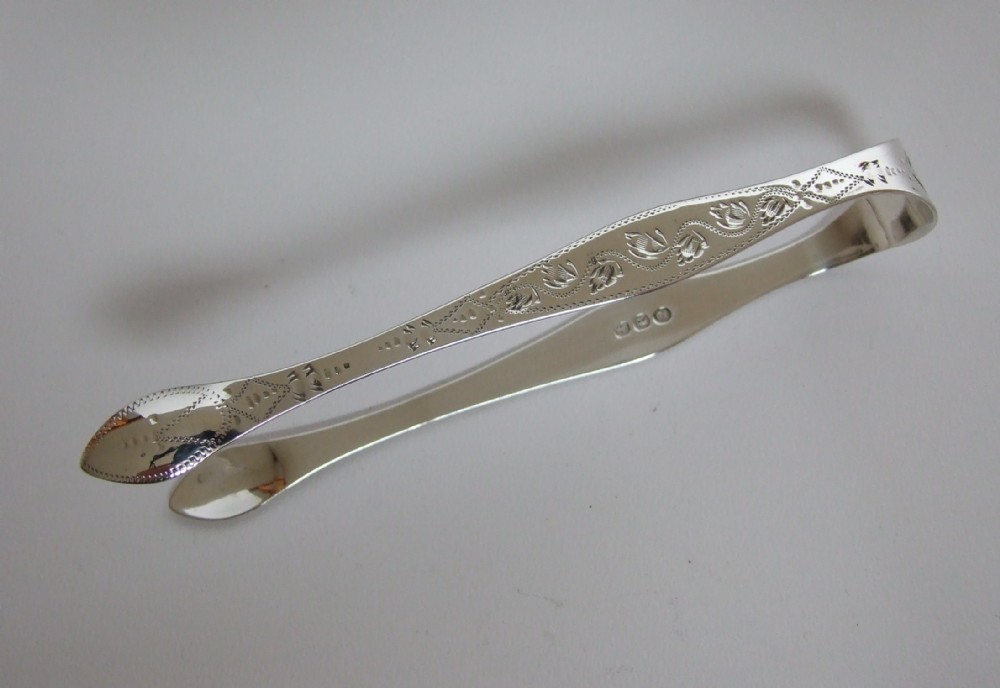 A gorgeous pair of Bateman Family Georgian silver tongs.