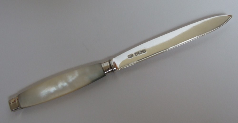 A handsome silver & mother-of-pearl letter opener.