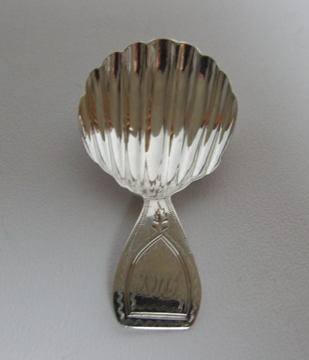 A lovely Georgian silver caddy spoon with rare hallmark.