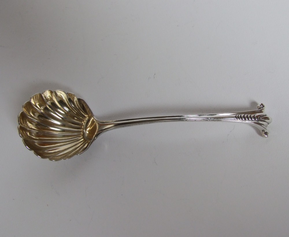 A superb cast silver cream/sauce ladle in Onslow pattern