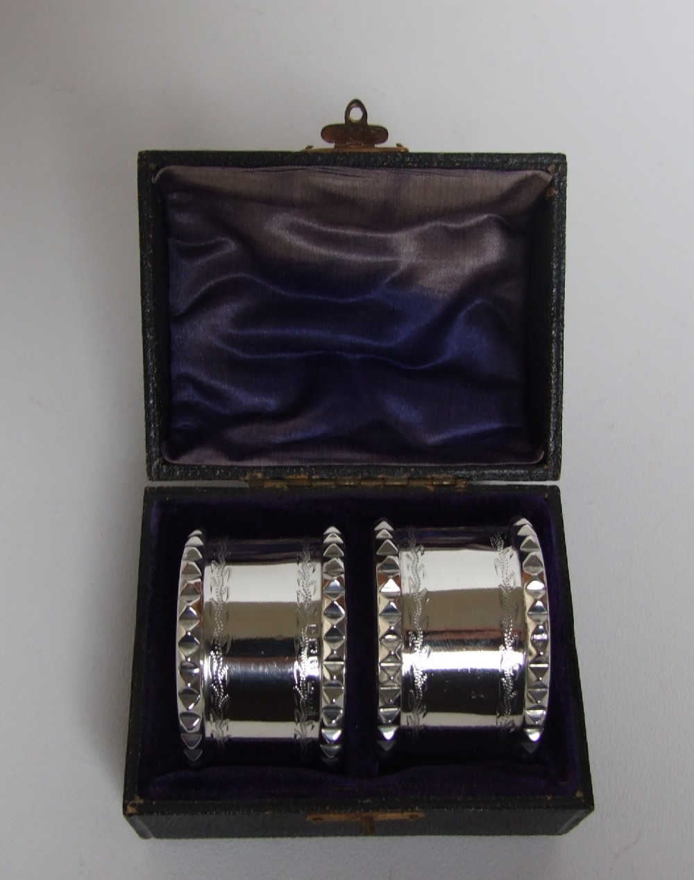A handsome pair of boxed Edwardian silver napkin rings.