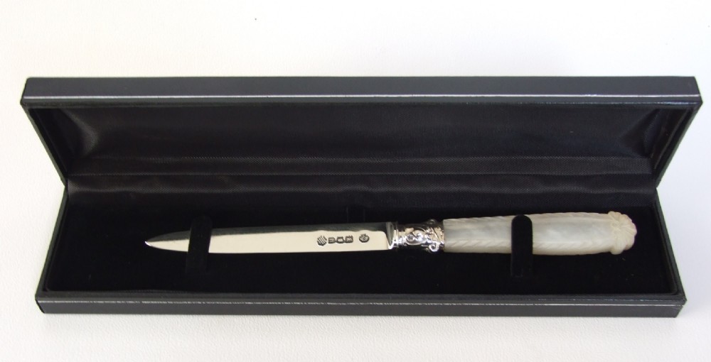A lovely silver and mother-of pearl letter opener.