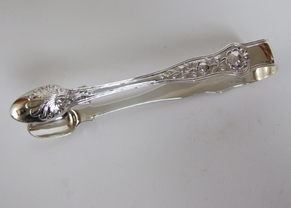 A quality pair of Victorian silver tongs in the rare Rose pattern.