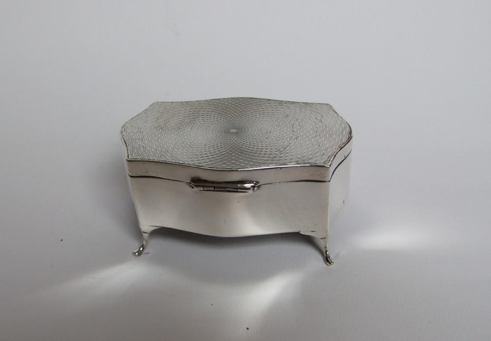 A gorgeous engine turned silver trinket box.
