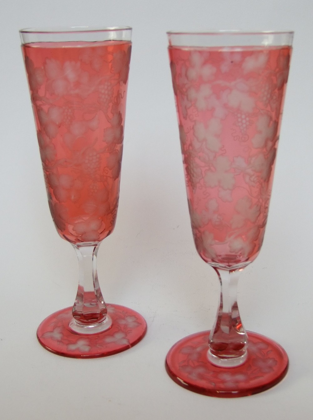 A gorgeous pair of Victorian cranberry champagne flutes.