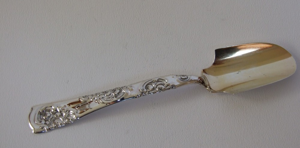 A fine Sterling silver stilton scoop.