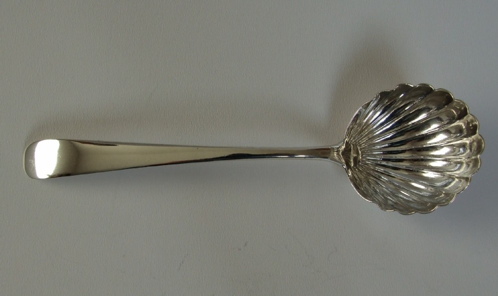A large 18th Century silver gravy ladle.