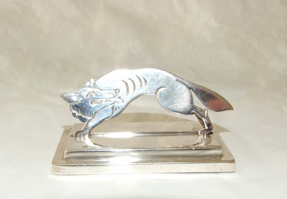 A superb 'silver fox' Edwardian place card or menu holder.