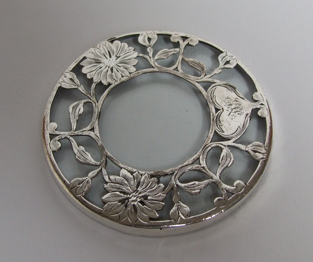 A lovely Sterling Silver wine glass coaster.