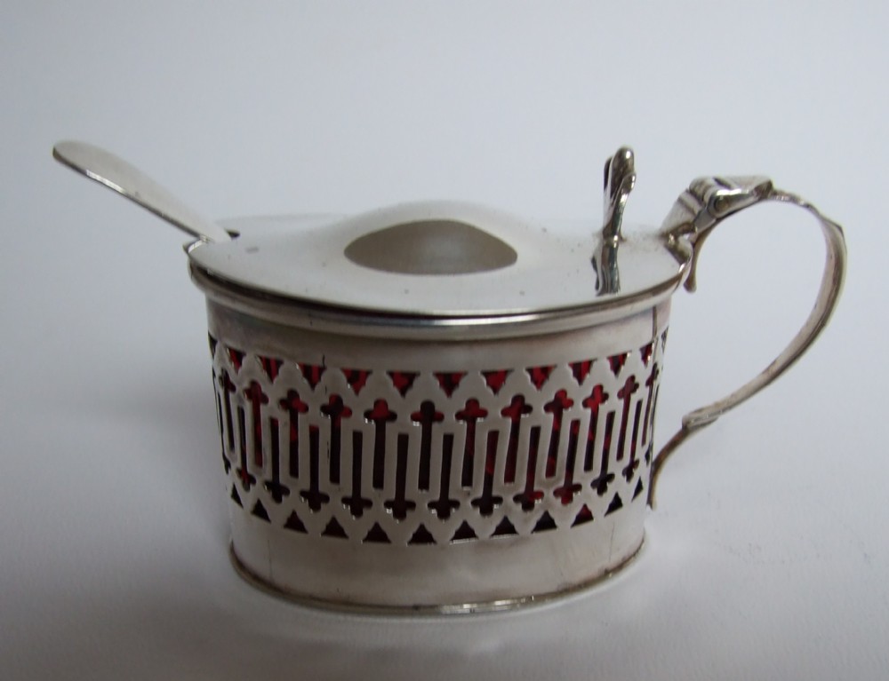 An unusual silver & cranberry mustard pot & spoon.