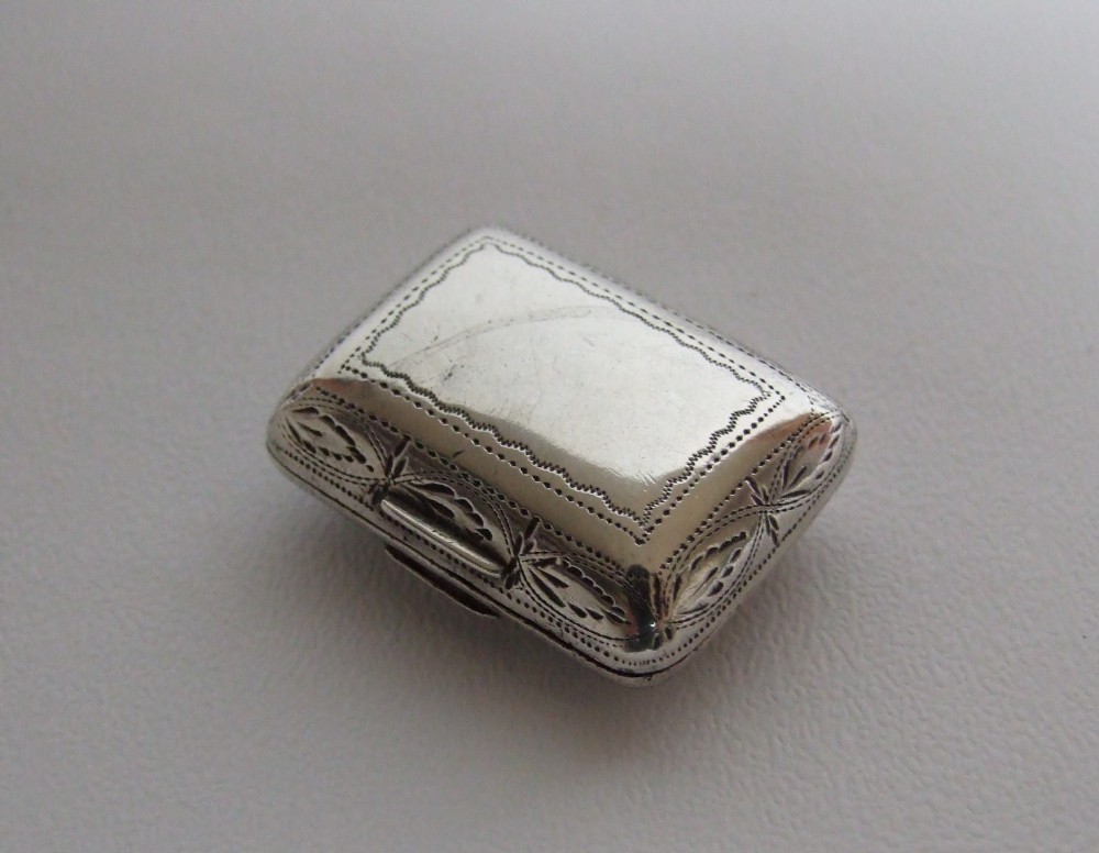 A stunning George III silver 'cushion' vinaigrette by Samuel Penbeton.