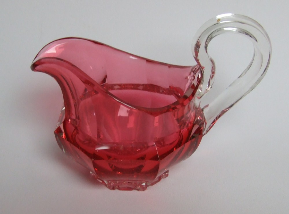 A superb Victorian cut glass cranberry cream jug.