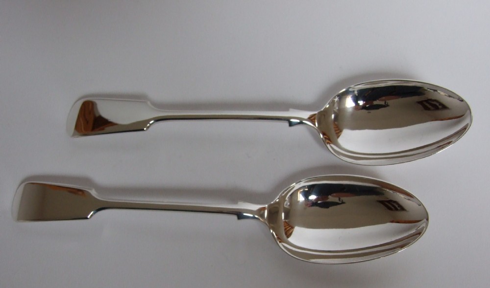 A handsome pair of Edwardian silver serving spoons by Mappin & Webb.