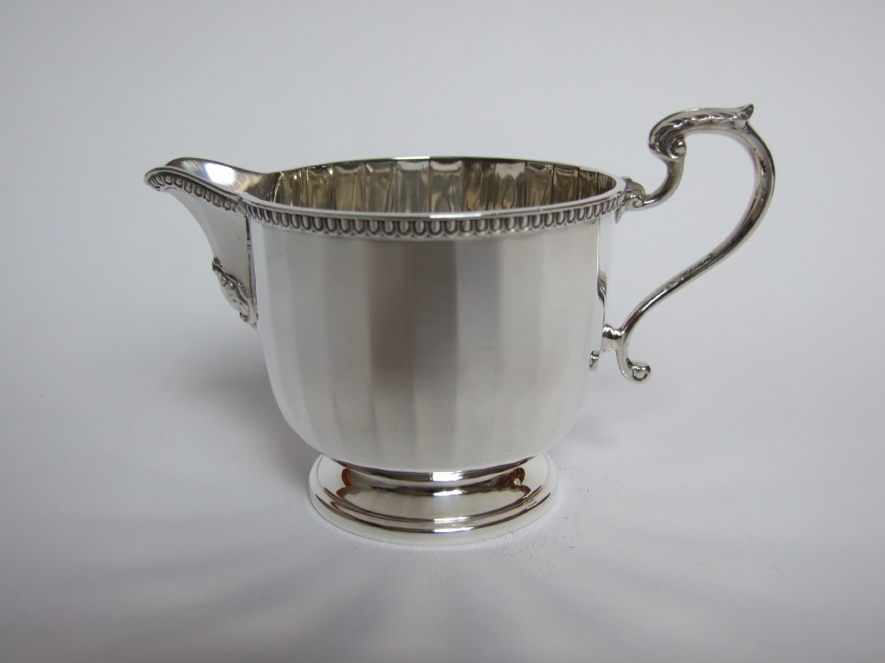 A good quality panelled silver cream jug.
