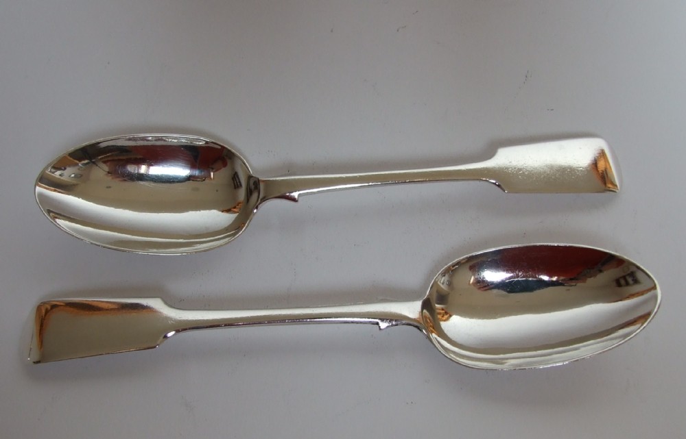 A handsome pair of Victorian silver serving spoons.