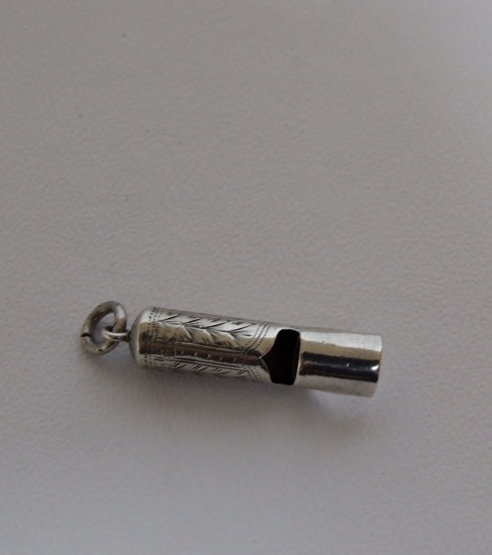 A charming Victorian small silver dog whistle.