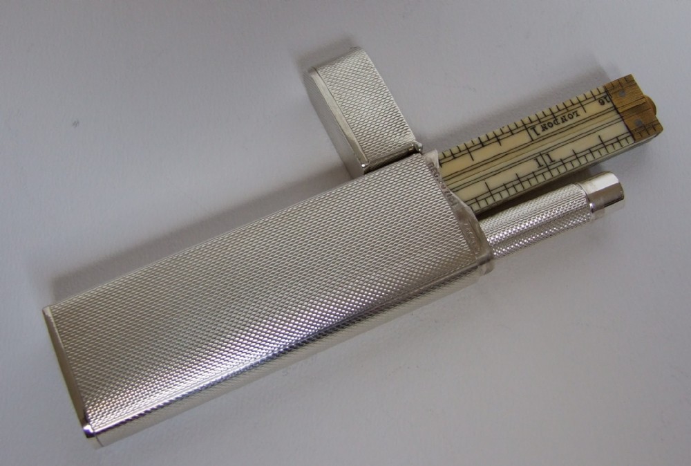 An exceptionally rare Asprey silver cased rule and pencil.
