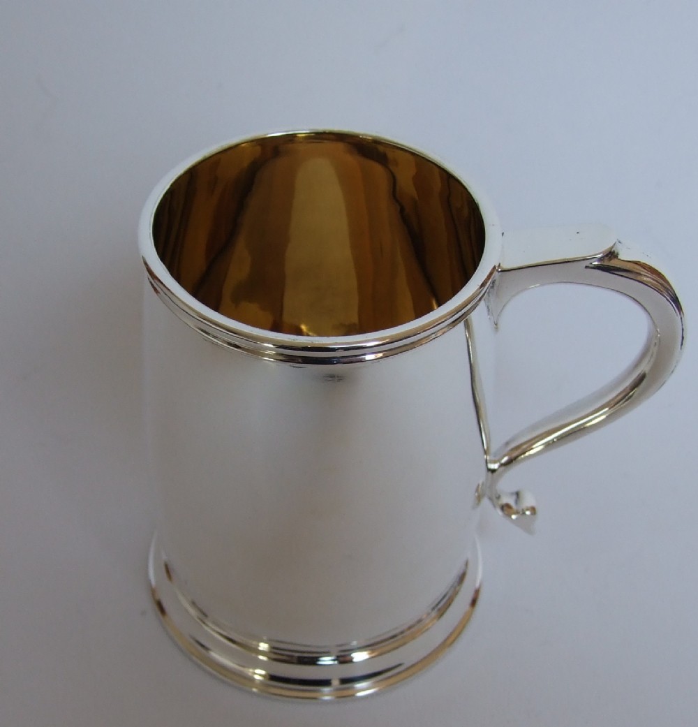 A superb quality George V silver mug.