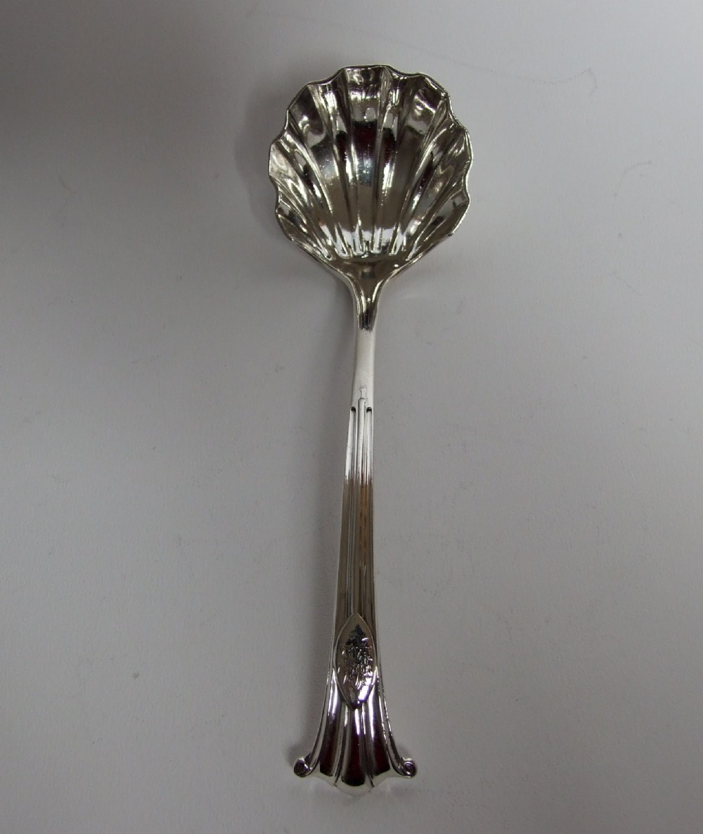 A magnificent Victorian Onslow pattern silver gravy/sauce ladle.