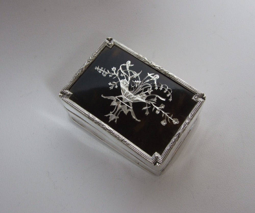 A delightful Edwardian silver & tortoiseshell trinket box with exquisite pique work.
