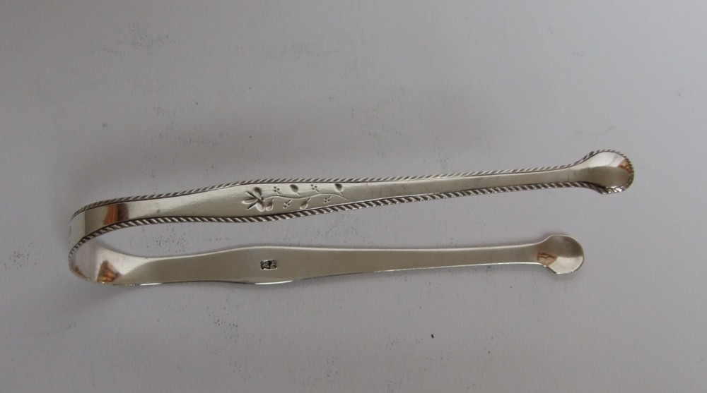 A charming pair of Hester Bateman silver tongs.