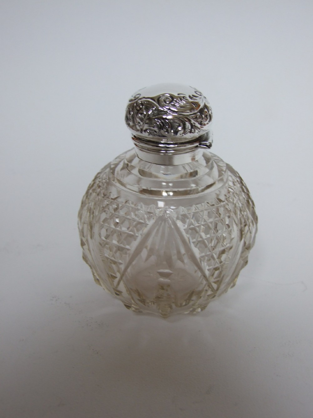 A gorgeous silver mounted Victorian perfume bottle.