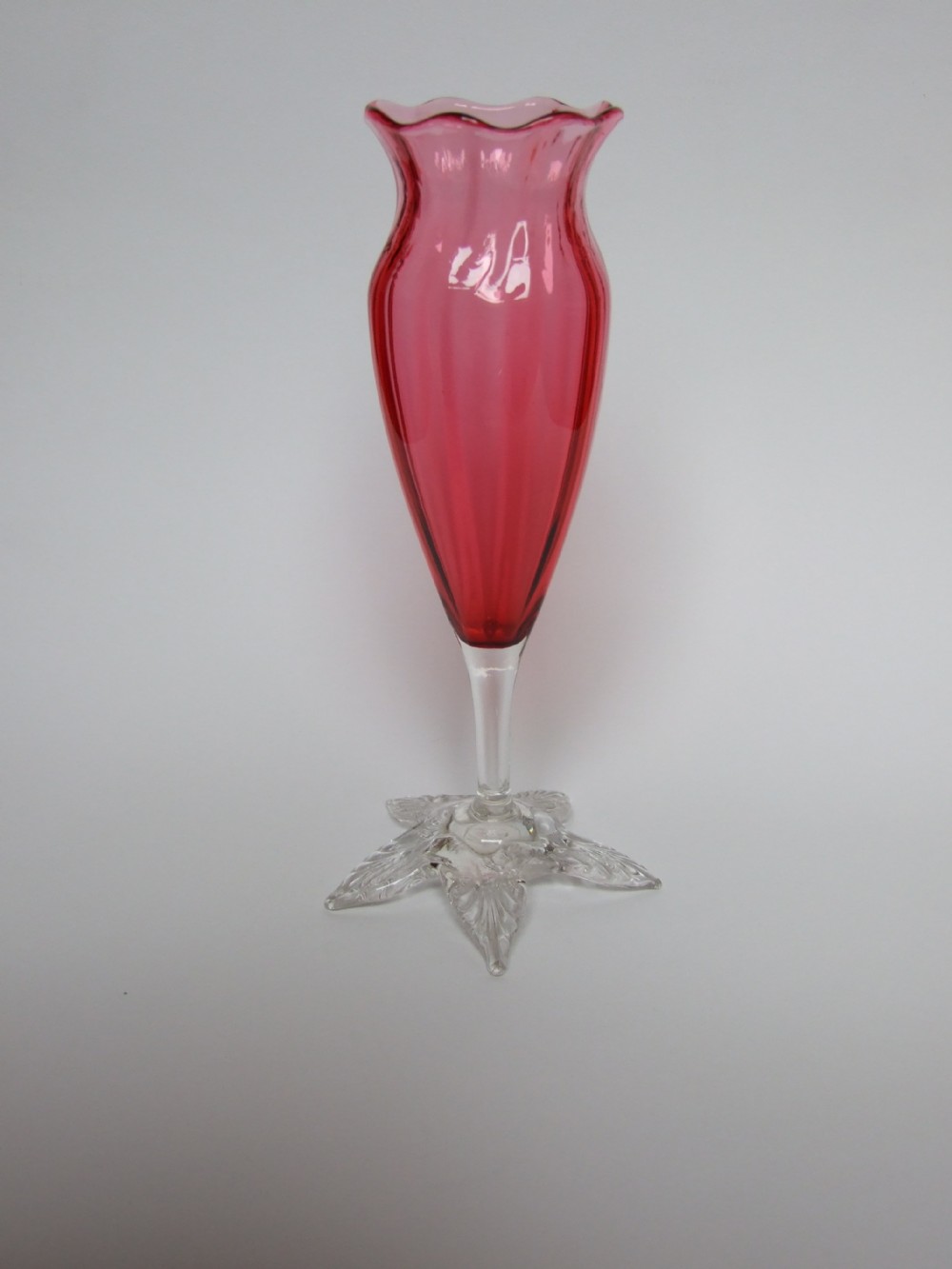 A charming Victorian cranberry bud vase.