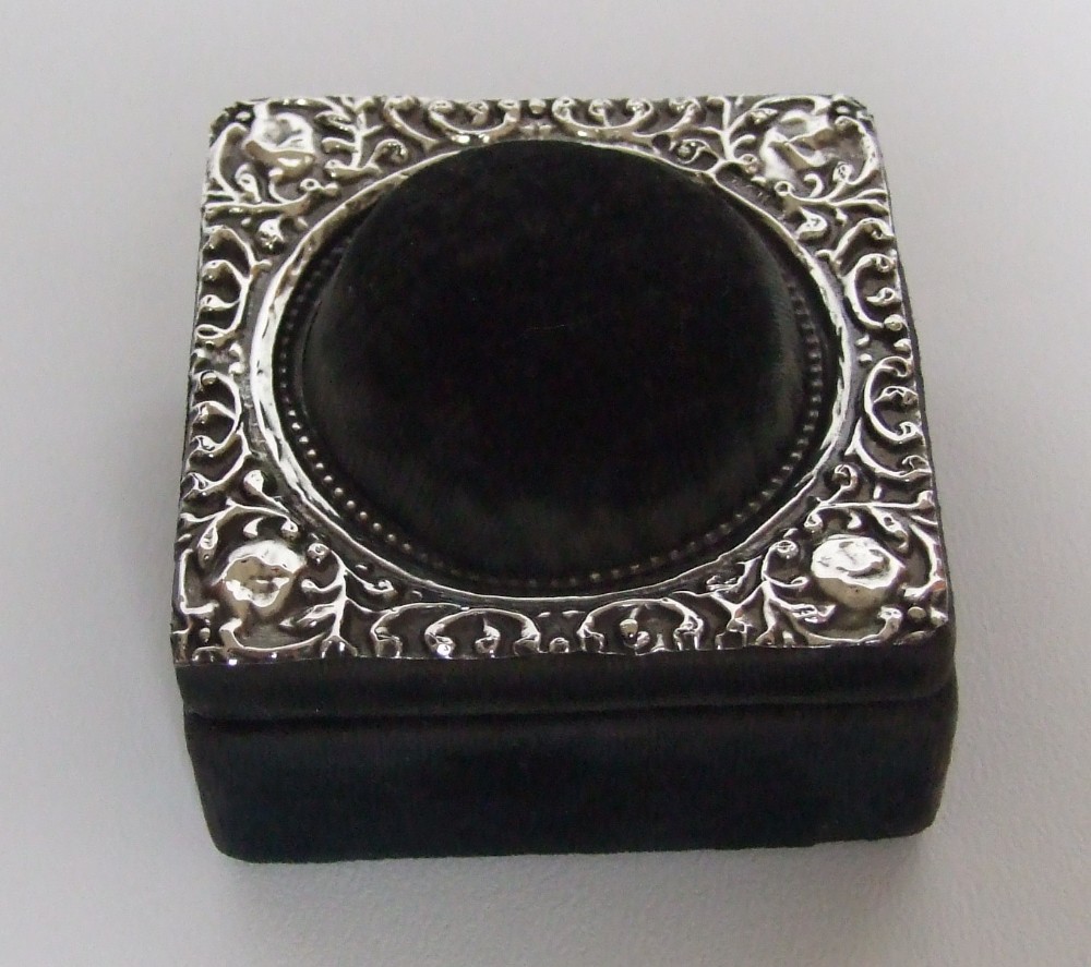A delightful Edwardian silver mounted trinket box with pincushion lid.
