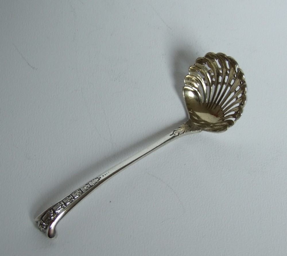 A rare silver Onslow pattern spice sifting spoon.